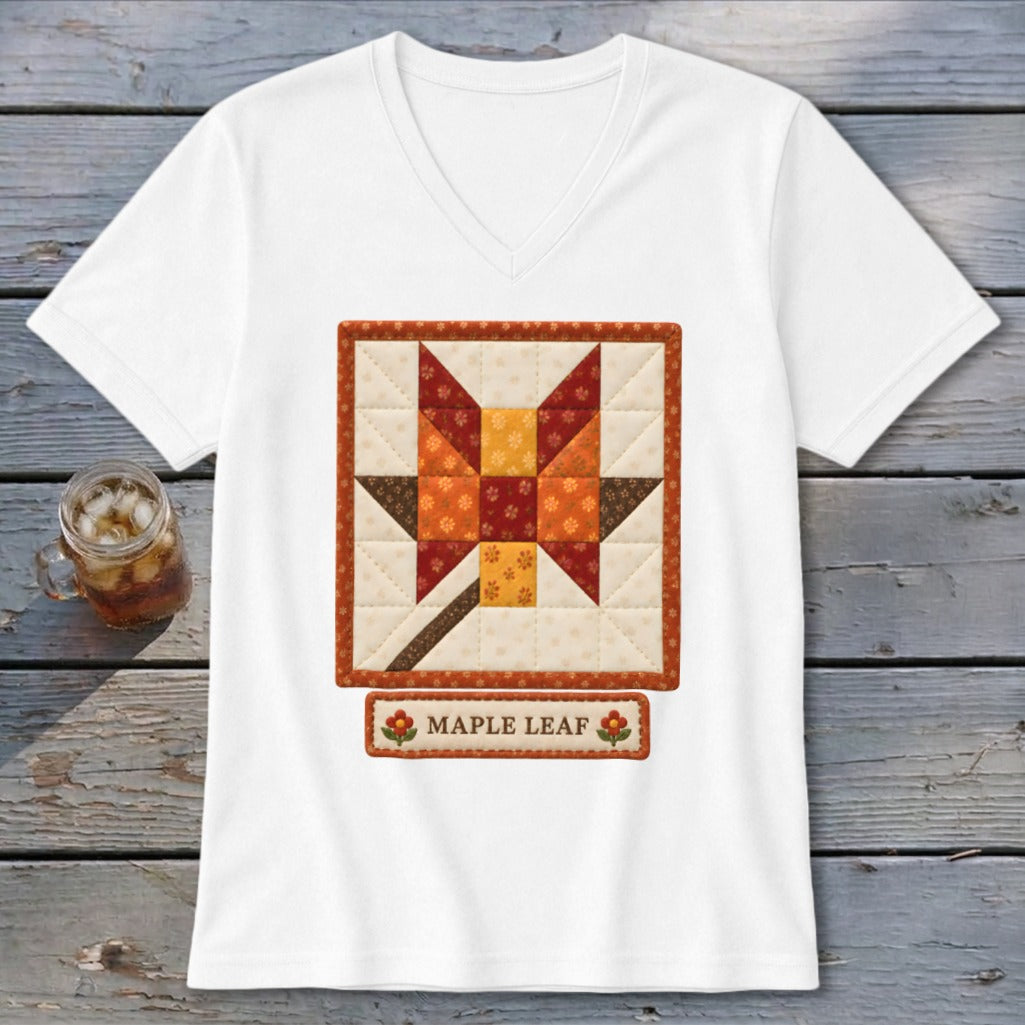 White t-shirt with a quilted maple leaf design and "Maple Leaf" text.