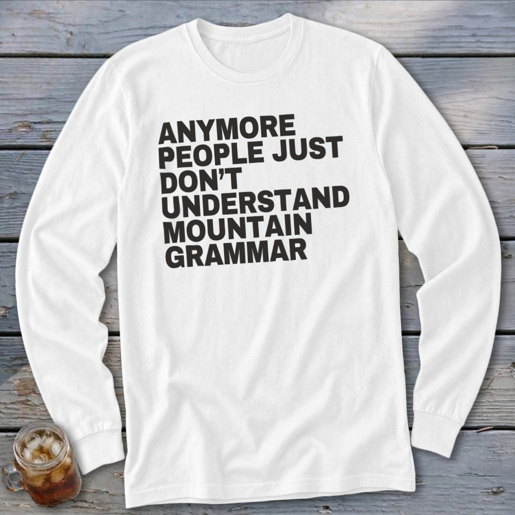 White long-sleeve shirt with black text that reads "anymore people just don't understand mountain grammar".