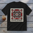 A black t-shirt features a geometric quilt design with red, white, and black shapes and the text Appalachia.