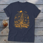 Navy t-shirt with orange mountain graphic, lantern, and text "If you hear whistlin', keep hiking."