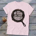 Pink t-shirt with "NO SUGAR IN THE CORNBREAD" text inside a skillet graphic.