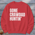 Red crewneck sweatshirt with white text reading "GONE CRAWDAD HUNTIN'".