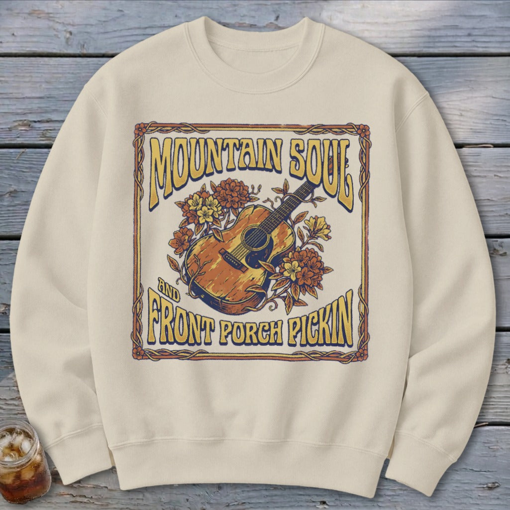 Cream sweatshirt with a vintage guitar and floral graphic reading "Mountain Soul and Front Porch Pickin'".