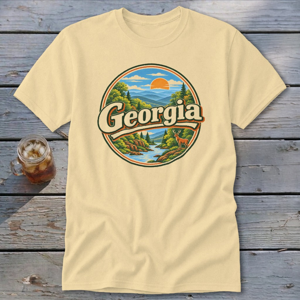 Cream t-shirt with a circular Georgia mountain landscape graphic and a deer.