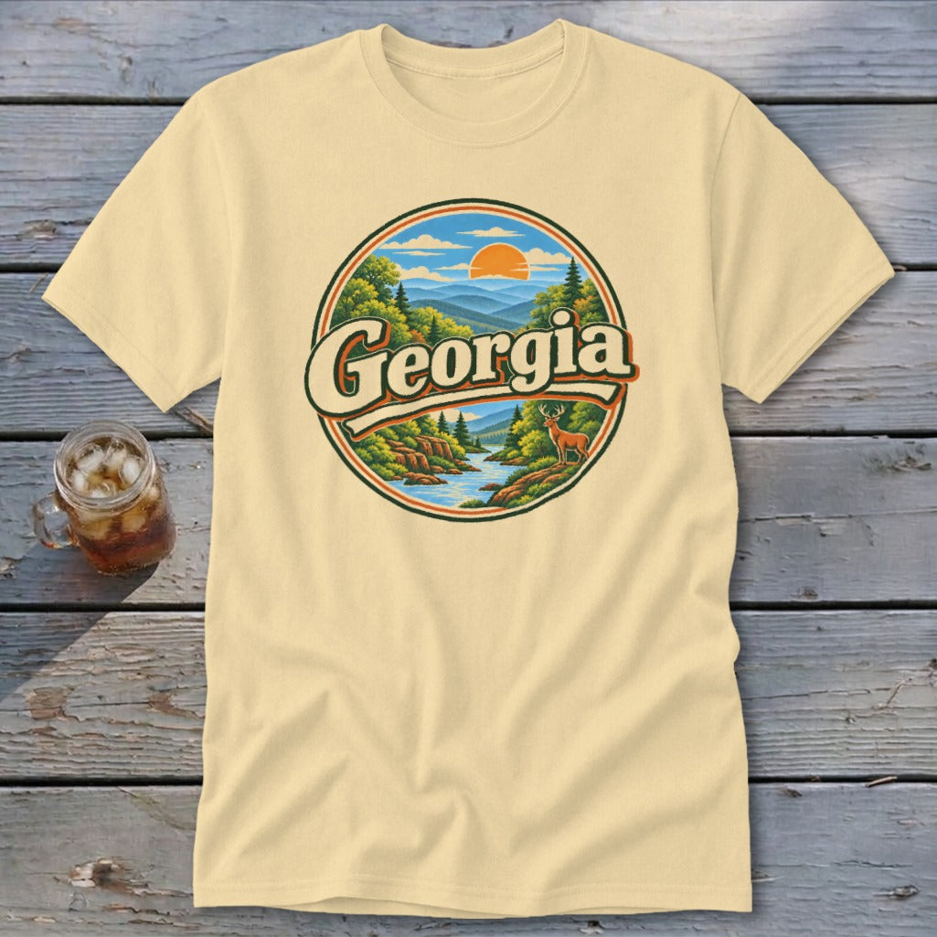 Cream t-shirt with a circular Georgia mountain landscape graphic and a deer.