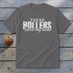Gray t-shirt with white text reading "THESE HOLLERS know my name".