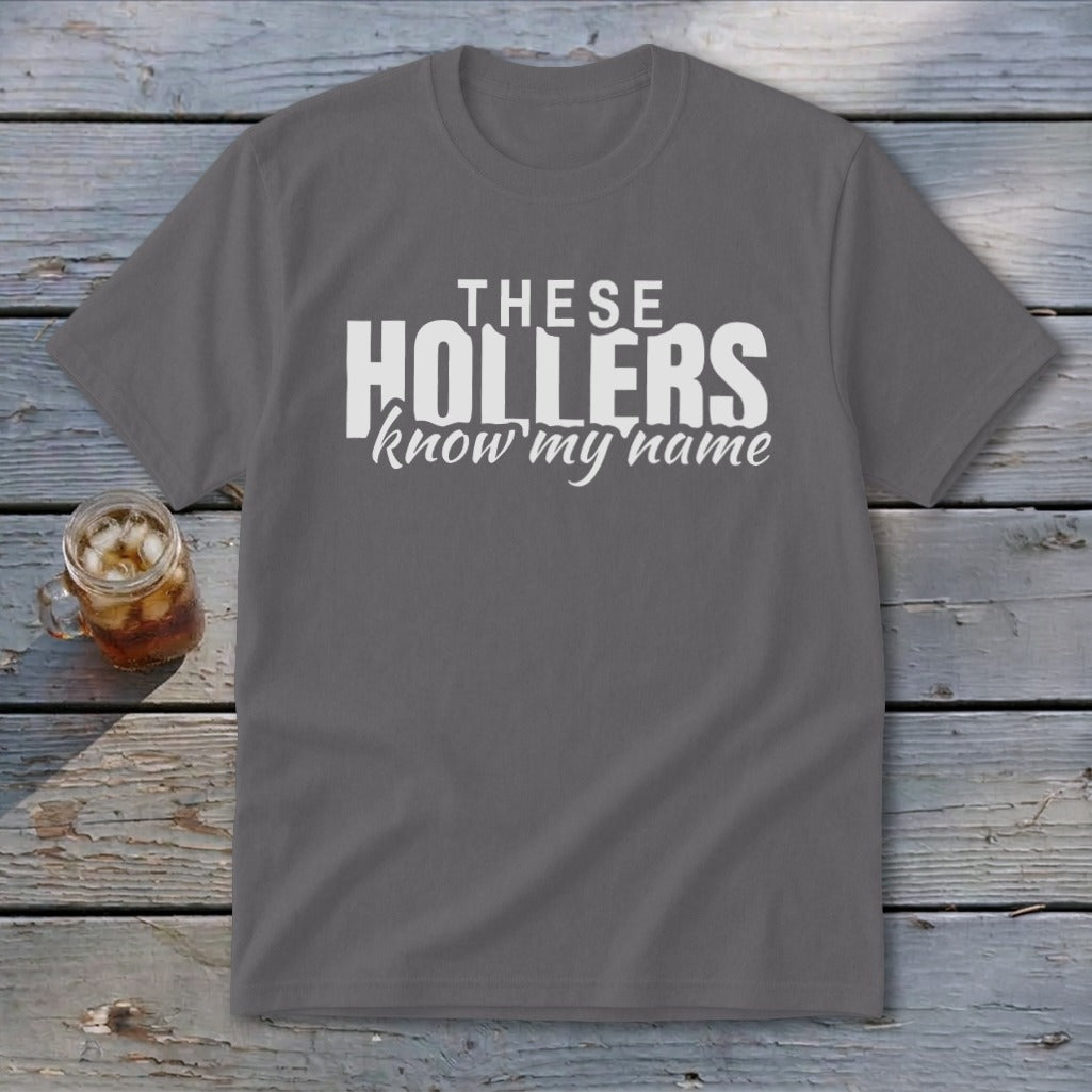 Gray t-shirt with white text reading "THESE HOLLERS know my name".
