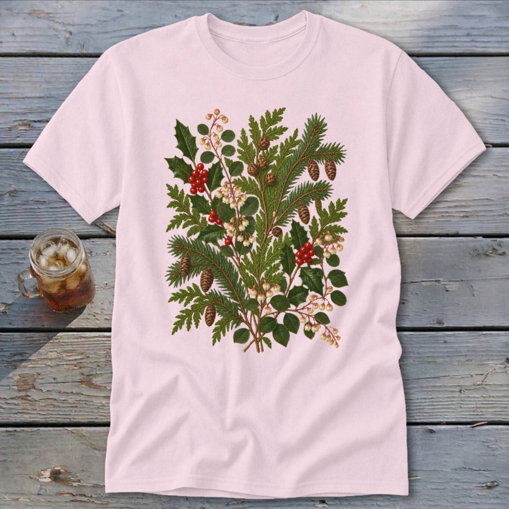 Light pink t-shirt with a central botanical print of evergreen branches, pinecones, holly, and berries.