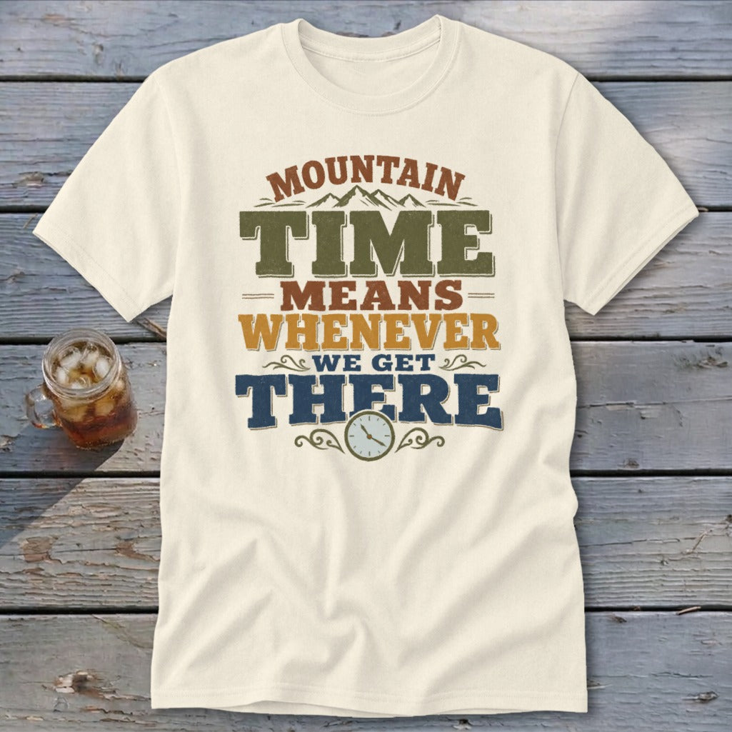 Cream t-shirt with "MOUNTAIN TIME MEANS WHENEVER WE GET THERE" text and a clock icon.