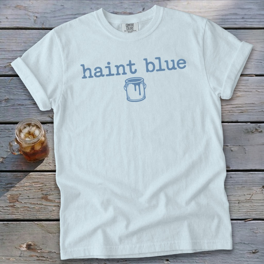 White Comfort Colors t-shirt with "haint blue" text and paint can graphic.