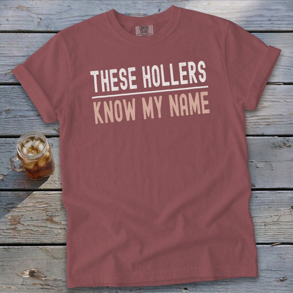 Rose t-shirt with "THESE HOLLERS KNOW MY NAME" text.