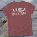 Rose t-shirt with "THESE HOLLERS KNOW MY NAME" text.