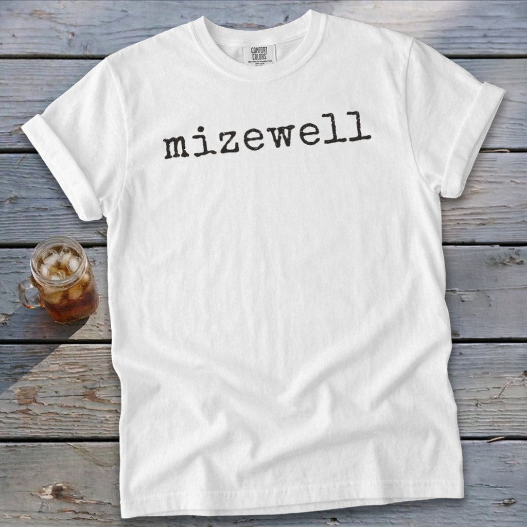 White t-shirt with black typewriter font text that says "Mizewell."