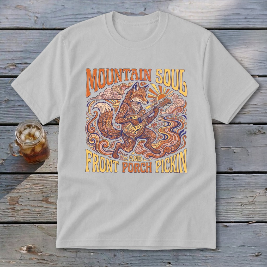Light grey t-shirt with a graphic of a fox playing a banjo, text "MOUNTAIN SOUL AND FRONT PORCH PICKIN".