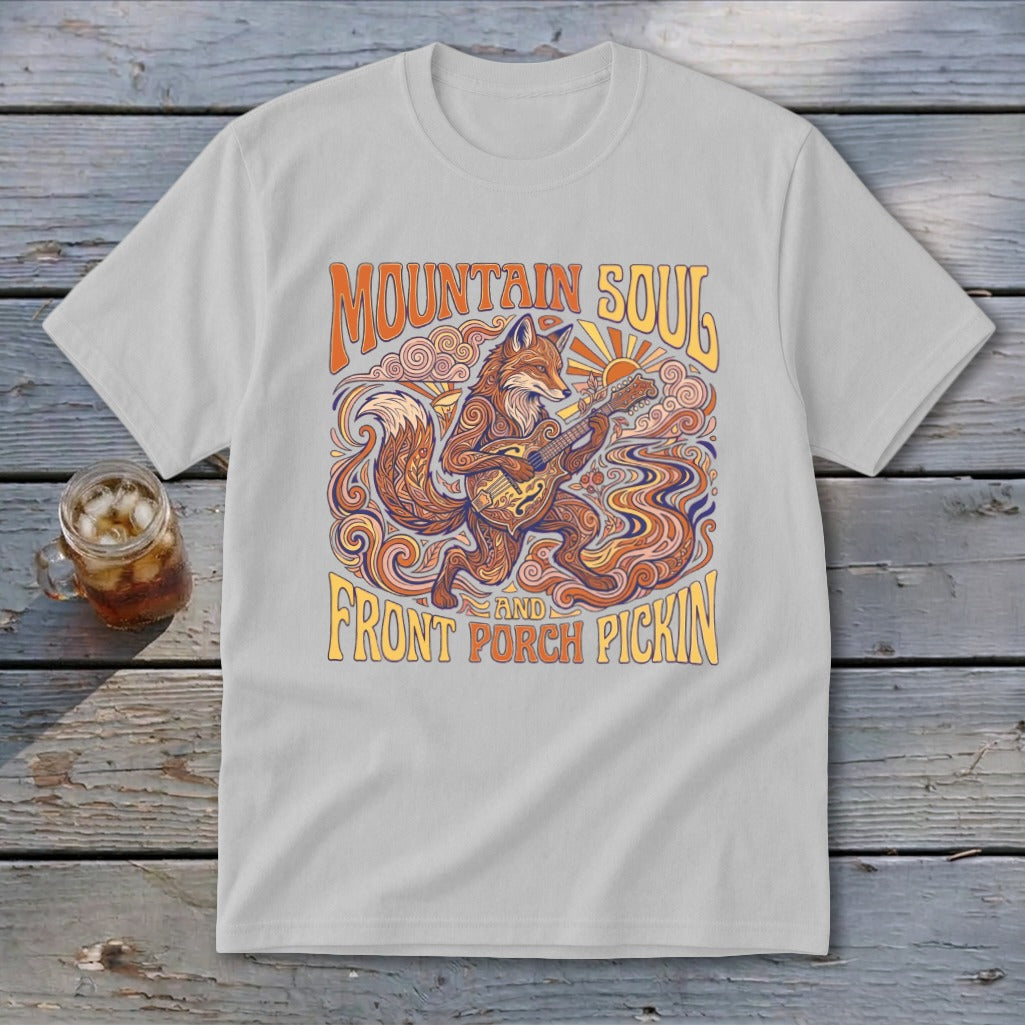 Light grey t-shirt with a graphic of a fox playing a banjo, text "MOUNTAIN SOUL AND FRONT PORCH PICKIN".