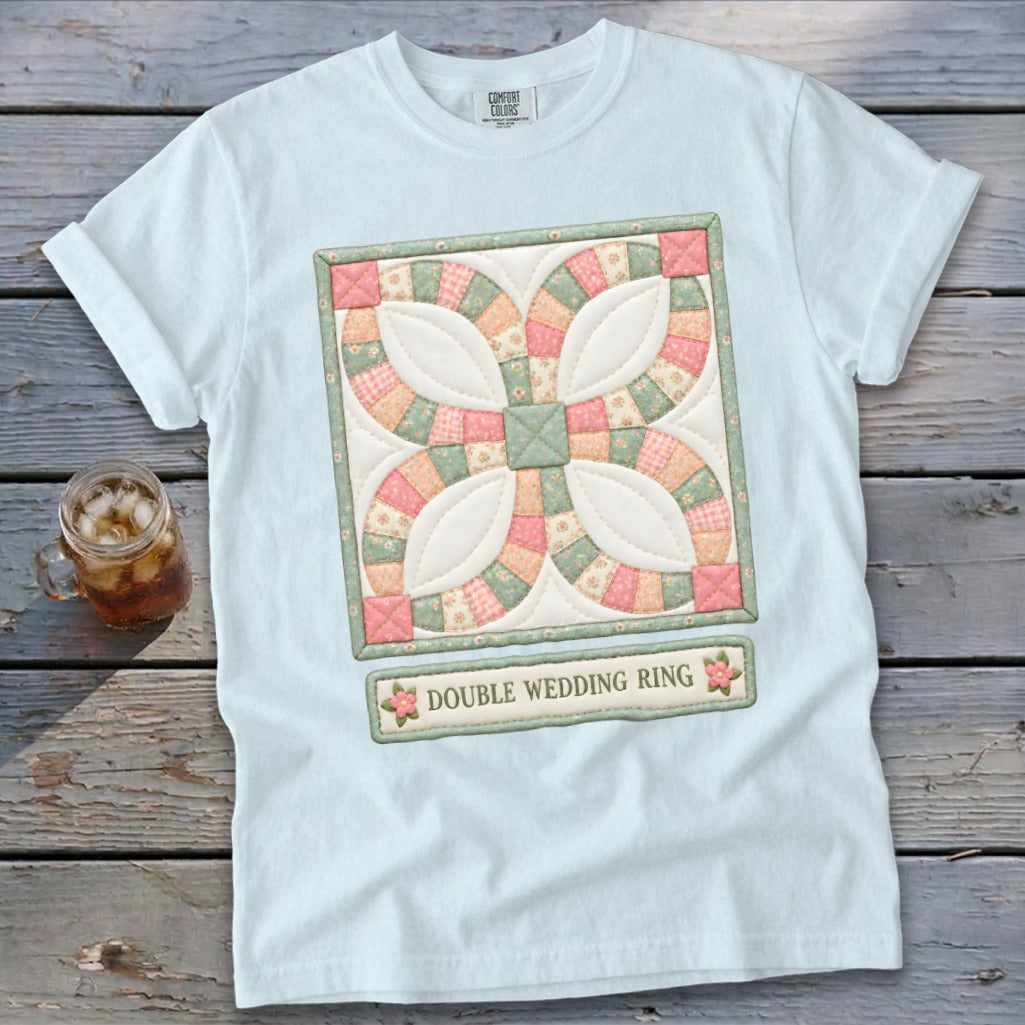 Light blue t-shirt with a double wedding ring quilt design and text.