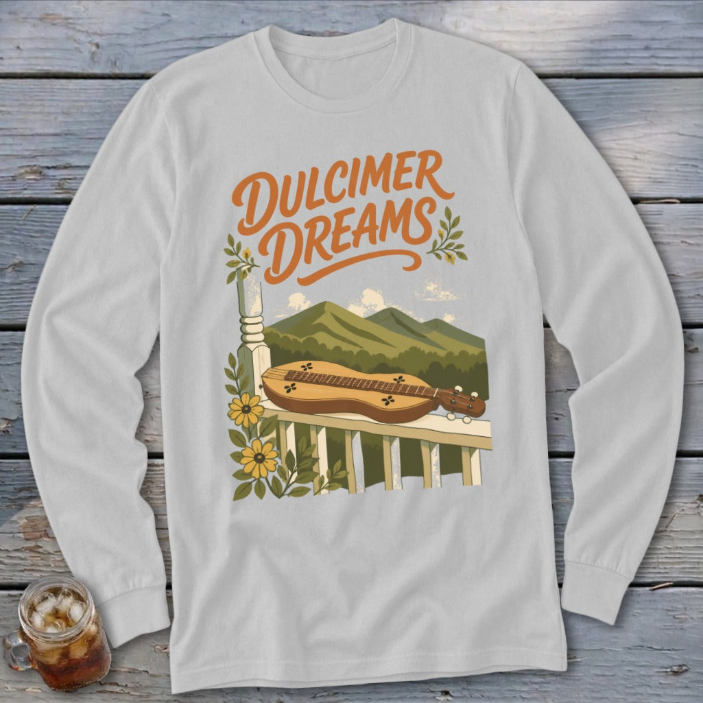 Dulcimer Dreams graphic on a white long sleeve shirt with a dulcimer on a porch railing.