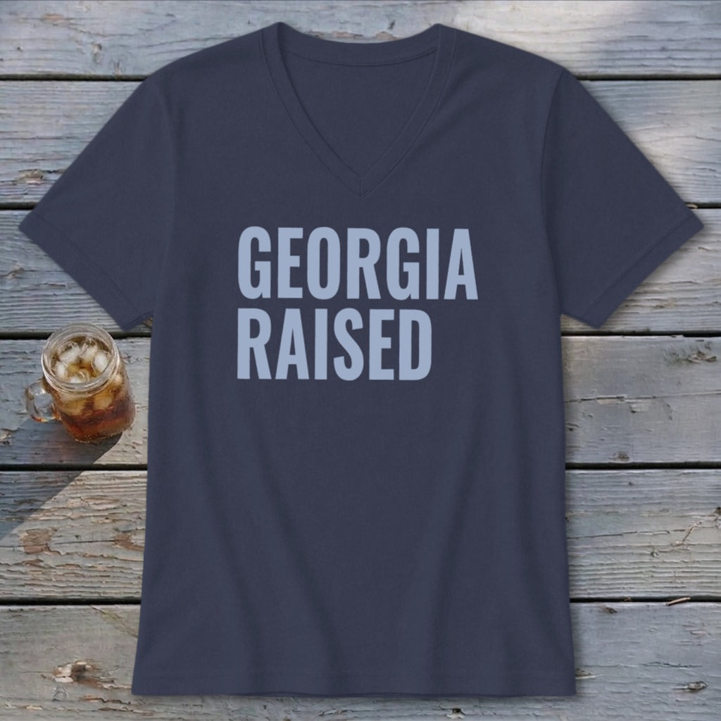 Dark blue v-neck t-shirt with "GEORGIA RAISED" in light blue text.