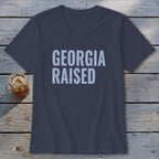 Dark blue v-neck t-shirt with "GEORGIA RAISED" in light blue text.