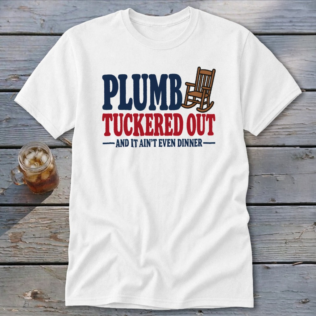 White t-shirt with "PLUMB TUCKERED OUT AND IT AIN'T EVEN DINNER" text and rocking chair graphic.