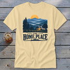 Light yellow t-shirt with "The Home Place" text and a landscape with a house.