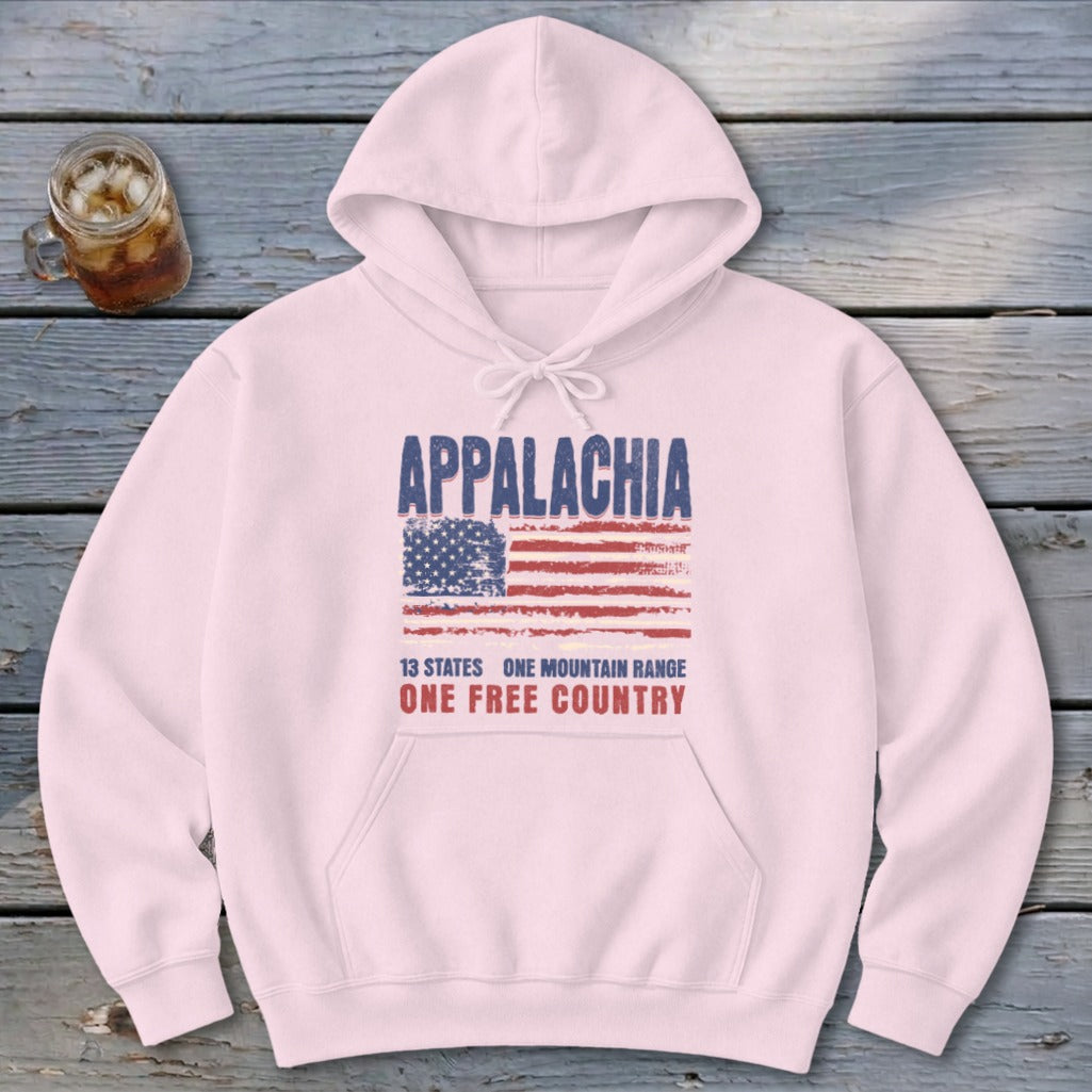 Light pink hoodie featuring a distressed American flag and text reading Appalachia, 13 States, One Mountain Range, One Free Country.