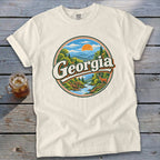 Cream t-shirt with circular Georgia mountain landscape and deer graphic.