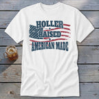 White t-shirt with distressed American flag graphic and text: Holler Raised American Made.