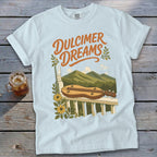 Light blue t-shirt with "Dulcimer Dreams" graphic featuring a dulcimer on a porch railing.