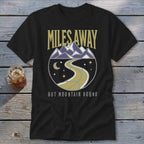 Black t-shirt with "Miles Away But Mountain Bound" text and circular mountain road design.