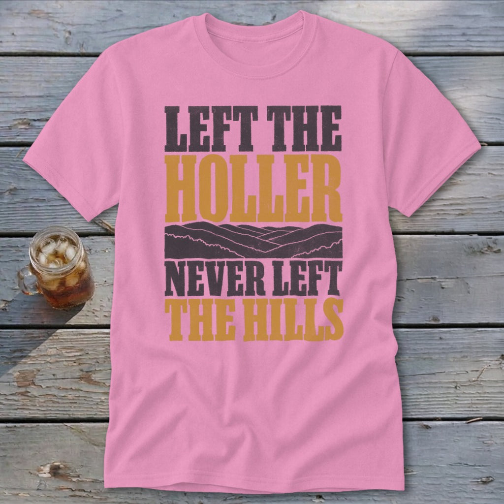 Pink t-shirt with text "LEFT THE HOLLER NEVER LEFT THE HILLS" and hills graphic.