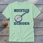 A mint green t-shirt featuring a dark blue banjo graphic with the words MOUNTAIN ECHOES.