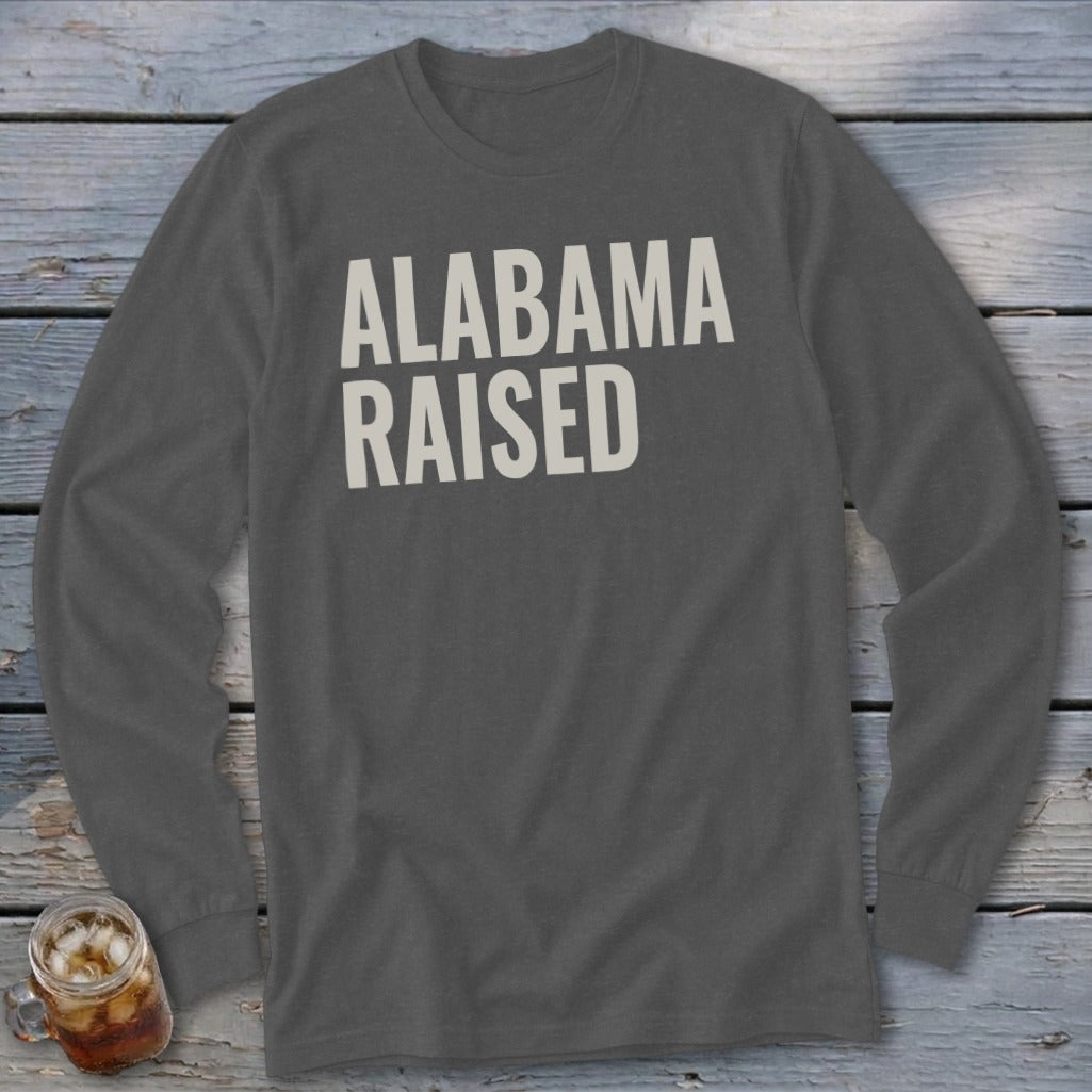 Dark gray long sleeve shirt with white "ALABAMA RAISED" text.