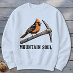 White sweatshirt with cardinal perched on a pickaxe, text "MOUNTAIN SOUL".