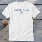 White t-shirt with "haint blue" text and a dripping paint can graphic.