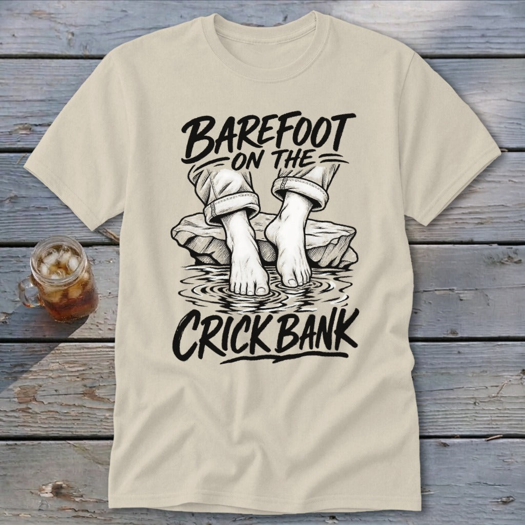 T-shirt with "BAREFOOT ON THE CRICK BANK" text and graphic of bare feet in water.