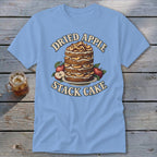 Light blue t-shirt with "Dried Apple Stack Cake" graphic and a stack of cake with apples.