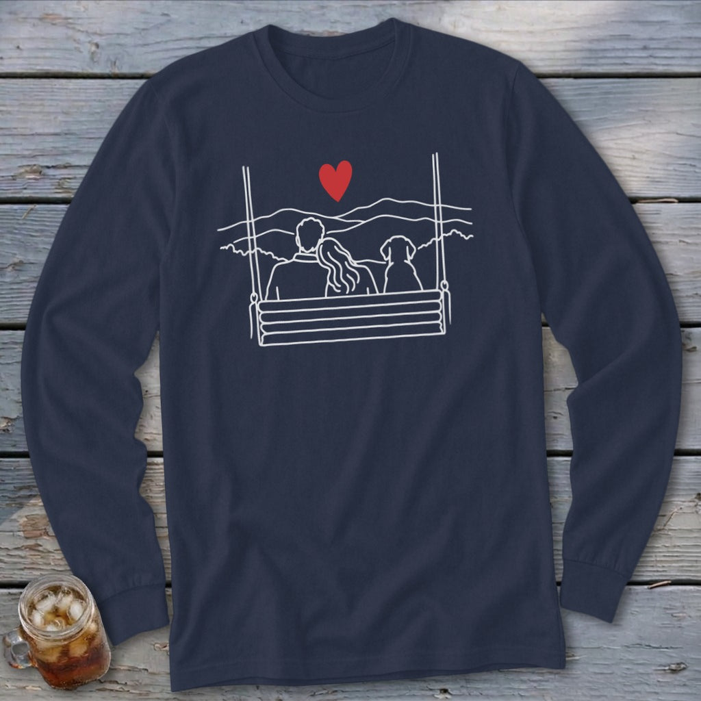 Couple and dog on swing with red heart and mountain landscape design.