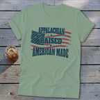 Light green t-shirt with distressed American flag and text: "APPALACHIAN RAISED AMERICAN MADE".