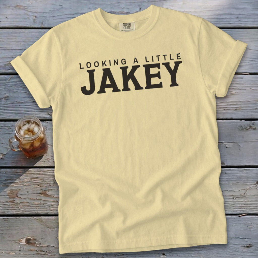 Pale yellow t-shirt with "LOOKING A LITTLE JAKEY" printed in black.