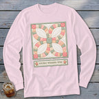 Pink long-sleeve shirt with a framed Double Wedding Ring quilt block design.