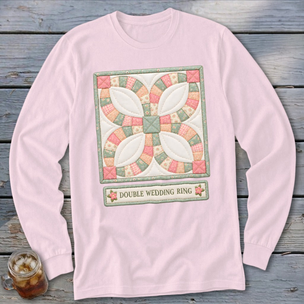 Pink long-sleeve shirt with a framed Double Wedding Ring quilt block design.