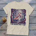 Cream t-shirt with a ghostly figure and trees design that reads "The Haints Ain't Left".