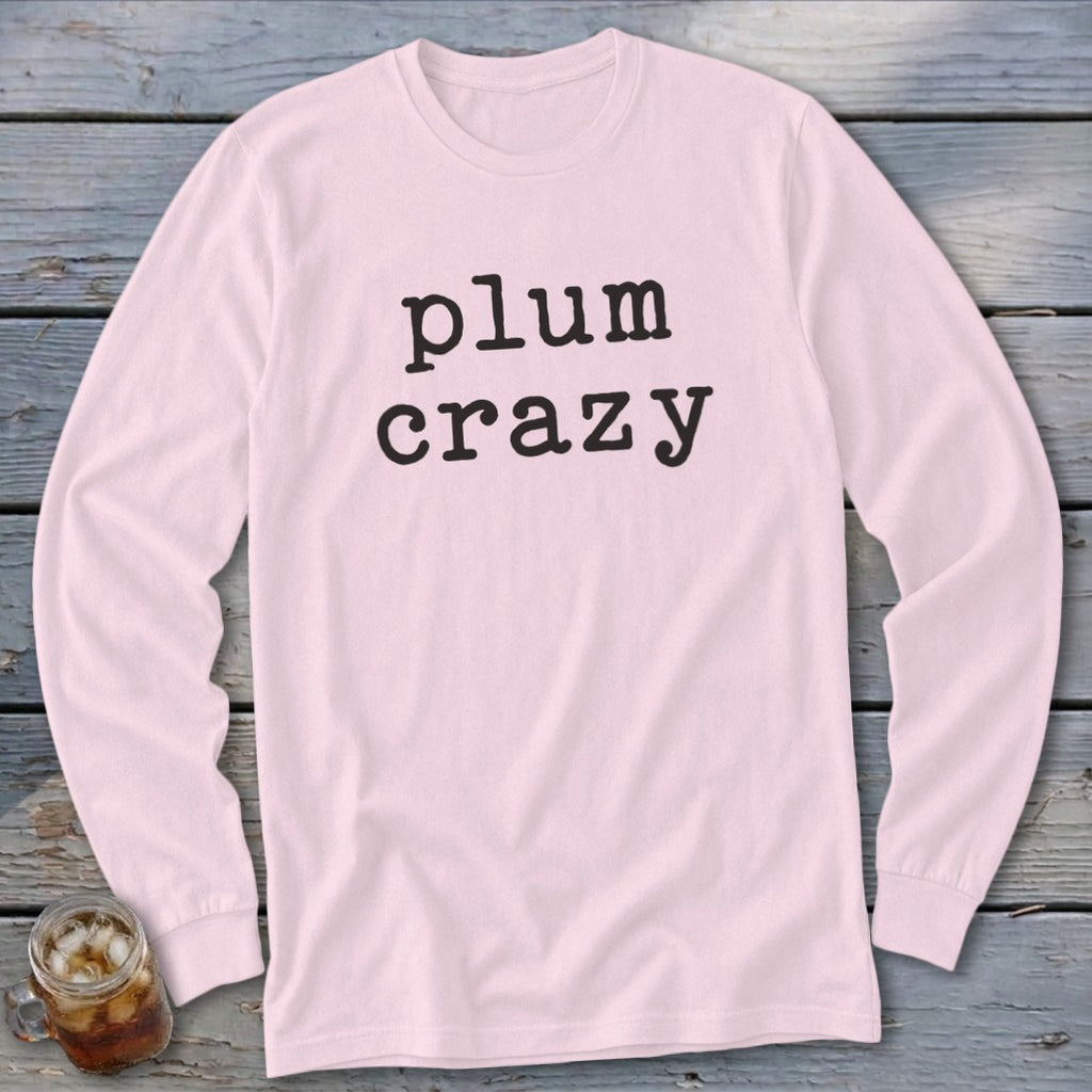 Light pink long-sleeve shirt with black text reading "plum crazy".