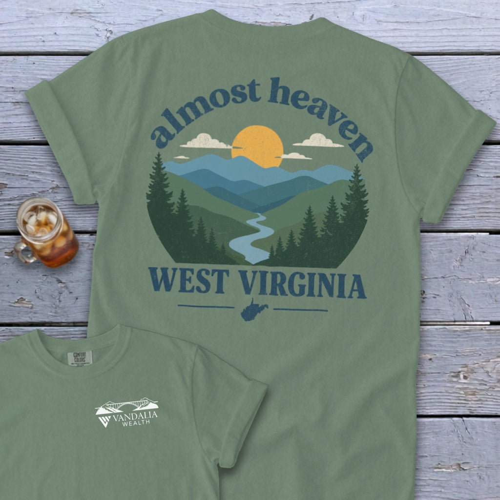 Green t-shirt with "almost heaven WEST VIRGINIA" and mountain landscape graphic.
