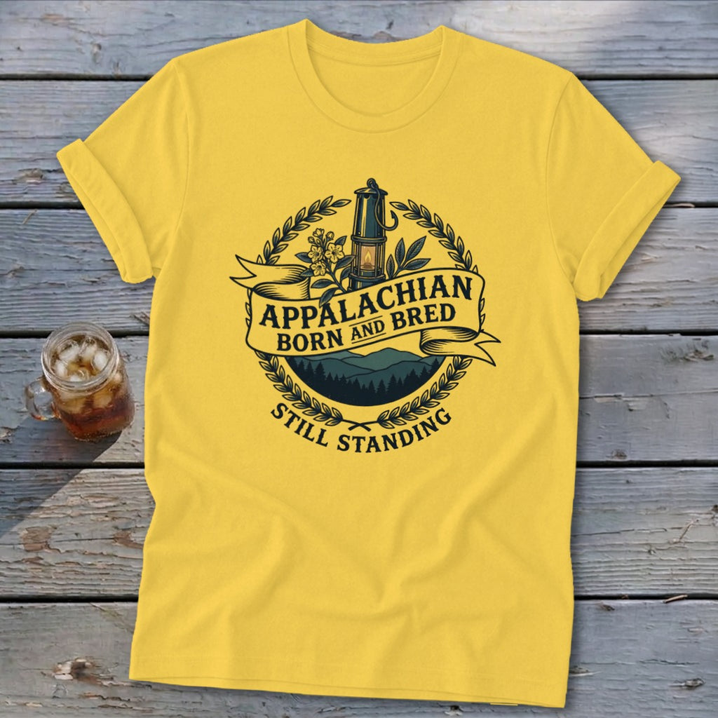 Yellow t-shirt with "Appalachian Born and Bred Still Standing" text and an oil lamp graphic.