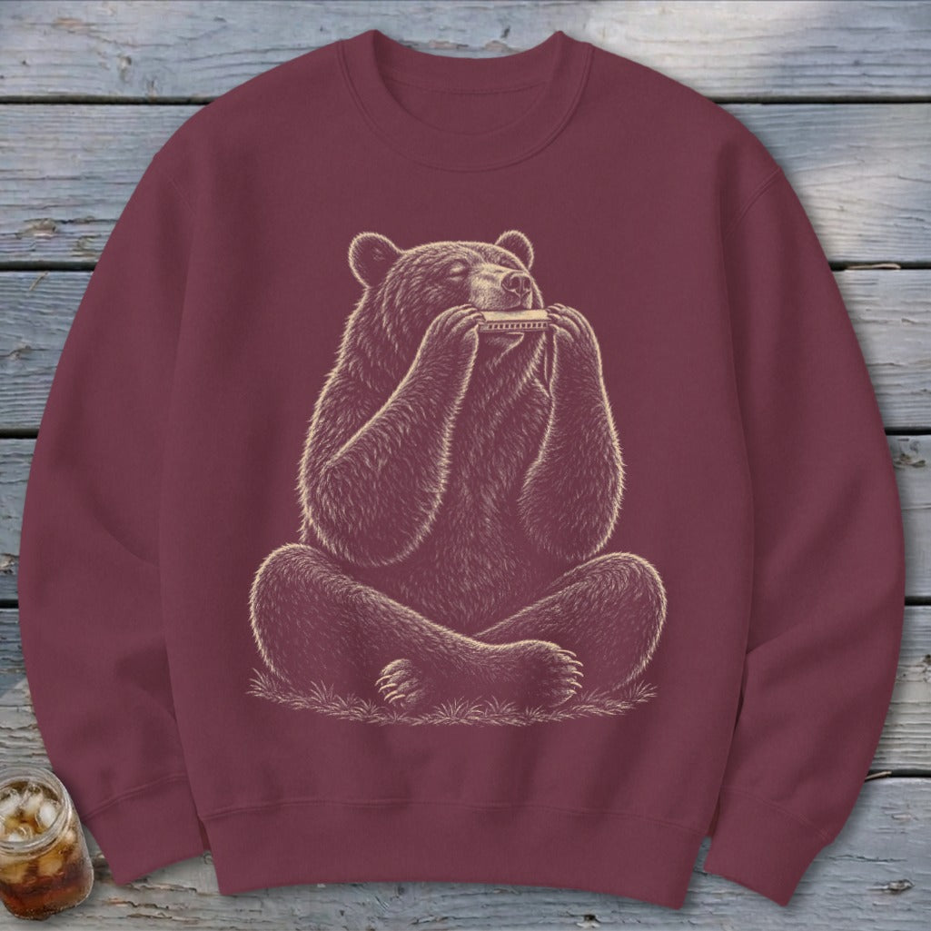 Maroon sweatshirt with illustration of a bear playing a harmonica.