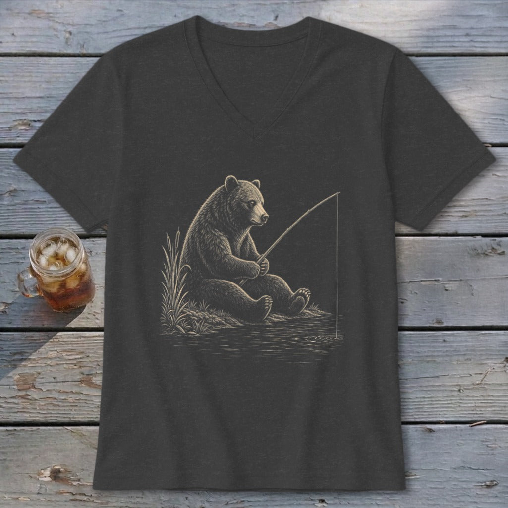 T-shirt featuring a bear fishing by the water with reeds.