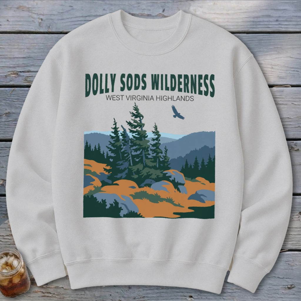 Light gray crewneck sweatshirt featuring a screen-printed graphic of Dolly Sods Wilderness with evergreen trees and mountains.
