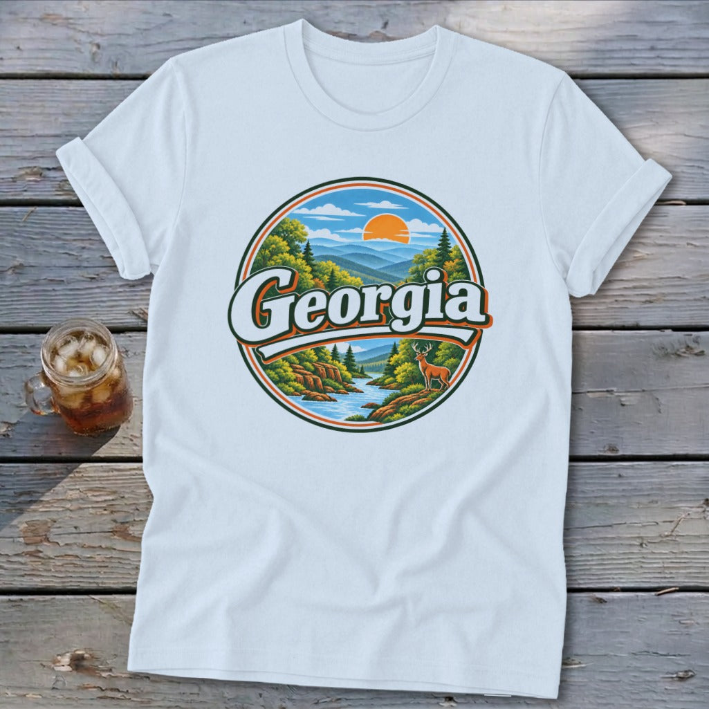 White t-shirt with a circular graphic of a Georgia landscape featuring a river, deer, and mountains.